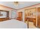 Traditional main bedroom offers natural light, ceiling fan and view to bathroom at 729 2Nd Bend Rd, Harleyville, SC 29448