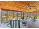 Covered porch with seating provides tranquil view of the property at 729 2Nd Bend Rd, Harleyville, SC 29448