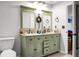 Bathroom features a double sink vanity with framed mirrors and updated fixtures at 8458 William Moultrie Dr, North Charleston, SC 29420
