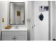 Bathroom with white vanity, updated fixtures, and modern mirror at 8458 William Moultrie Dr, North Charleston, SC 29420