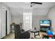 Bedroom featuring a large window for natural light, comfortable recliner, and television at 8458 William Moultrie Dr, North Charleston, SC 29420