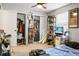Bedroom with a large window for natural light, open closet and full shelving at 8458 William Moultrie Dr, North Charleston, SC 29420