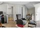 Bedroom featuring a comfortable recliner, closet and doorway to the side at 8458 William Moultrie Dr, North Charleston, SC 29420