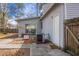Exterior view of a home with a patio, sliding glass door, and AC unit at 8458 William Moultrie Dr, North Charleston, SC 29420