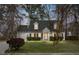 Charming two-story home featuring manicured lawn, inviting entryway, and attached garage at 8458 William Moultrie Dr, North Charleston, SC 29420