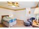 Relaxing bedroom with a fan, carpet and an accent chair at 9021 Delancey Cir, North Charleston, SC 29406