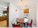 Cozy dining area featuring a chandelier and an oval wood dining table at 9021 Delancey Cir, North Charleston, SC 29406