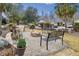 Community fire pit area with seating, landscaping, and a relaxing atmosphere at 9021 Delancey Cir, North Charleston, SC 29406