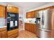 Modern kitchen with stainless steel refrigerator and black built-in oven at 9021 Delancey Cir, North Charleston, SC 29406