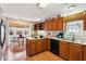 Bright kitchen boasts breakfast nook, double sink, granite countertops and wood cabinets at 9021 Delancey Cir, North Charleston, SC 29406