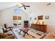 Cozy living room with vaulted ceiling, a ceiling fan, and access to the outdoor deck at 9021 Delancey Cir, North Charleston, SC 29406