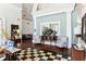Clubhouse lobby showcasing stylish decor, including patterned chairs, a large mirror, and hardwood floors at 9021 Delancey Cir, North Charleston, SC 29406