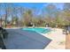 Outdoor pool area with lounging space and well-maintained landscaping at 9021 Delancey Cir, North Charleston, SC 29406