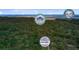 An aerial view of a neighborhood with logos for local attractions overlaid on the image at 958 Mikell Dr, Charleston, SC 29412