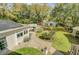 Expansive backyard with lush lawn, patio, swimming pool, and mature trees at 958 Mikell Dr, Charleston, SC 29412