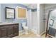 Bathroom with walk-in shower, single sink vanity, and framed mirror at 958 Mikell Dr, Charleston, SC 29412