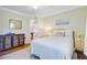 Cozy bedroom with wood floors, serene decor, and access to other rooms at 958 Mikell Dr, Charleston, SC 29412
