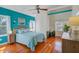 Stylish bedroom with hardwood floors, blue walls, and a comfortable bed at 958 Mikell Dr, Charleston, SC 29412