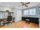 Charming bedroom with hardwood floors, ceiling fan, and custom built-in shelves at 958 Mikell Dr, Charleston, SC 29412