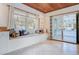 Bright breakfast nook with custom bench seating and a view of the outdoors through the glass doors at 958 Mikell Dr, Charleston, SC 29412