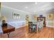 Elegant dining room with hardwood floors, stylish furnishings, and abundant natural light, perfect for Gathering gatherings at 958 Mikell Dr, Charleston, SC 29412