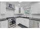 Kitchen featuring stainless steel appliances, white cabinets, and a subway tile backsplash at 958 Mikell Dr, Charleston, SC 29412
