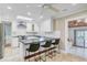 Well-lit kitchen with a large center island, barstool seating, and skylight at 958 Mikell Dr, Charleston, SC 29412