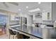 Open-concept kitchen with island seating and modern stainless steel appliances at 958 Mikell Dr, Charleston, SC 29412