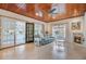 Inviting living room with tile floors, fireplace, wood ceiling, and sliding glass doors at 958 Mikell Dr, Charleston, SC 29412