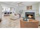 Inviting living room with fireplace and open flow to the kitchen area at 958 Mikell Dr, Charleston, SC 29412