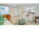 Bright, airy living room with tile floors, neutral furniture, and open concept design at 958 Mikell Dr, Charleston, SC 29412