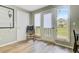 Mud room with access to the backyard, a rocking chair, and natural light at 958 Mikell Dr, Charleston, SC 29412