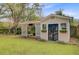 Exterior view of shed with double doors and adjacent outdoor living space at 958 Mikell Dr, Charleston, SC 29412