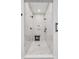 Luxurious shower featuring three shower heads, marble tiling, and mosaic tile flooring at 958 Mikell Dr, Charleston, SC 29412