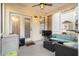 This covered back porch is perfect for entertaining or relaxing, with a ceiling fan and outdoor lighting at 103 Avalon Ct, Goose Creek, SC 29445