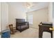 This bedroom features a dark wooden crib with an adjoining rocking chair and a window at 103 Avalon Ct, Goose Creek, SC 29445