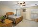 This neutral bedroom features a ceiling fan, bright window, and light-colored walls at 103 Avalon Ct, Goose Creek, SC 29445