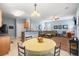 Open-concept kitchen and living area with wood cabinets, an eat-in table, and view into the living space at 103 Avalon Ct, Goose Creek, SC 29445