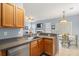 Functional kitchen with stainless steel appliances, wood cabinetry, and a view into the dining area, perfect for modern living at 103 Avalon Ct, Goose Creek, SC 29445
