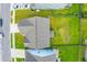 An aerial shot showcases the roof and backyard, in addition to neighboring properties, in this quiet suburban setting at 107 Goose Rd, Summerville, SC 29483
