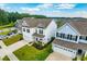 Stunning aerial showcases a suburban neighborhood, highlighting manicured lawns, driveways, and charming home exteriors at 107 Goose Rd, Summerville, SC 29483