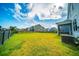 Large backyard with healthy lawn, surrounded by a fence, offering privacy and space for recreation at 107 Goose Rd, Summerville, SC 29483