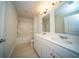 Well-lit bathroom featuring double sinks and a shower-tub combo at 107 Goose Rd, Summerville, SC 29483