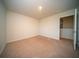 Bright bedroom features neutral carpeting, a window, and doorway at 107 Goose Rd, Summerville, SC 29483