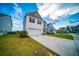 Charming two-story home featuring a well-manicured lawn and a classic white exterior, perfect for suburban living at 107 Goose Rd, Summerville, SC 29483
