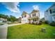Charming two-story home featuring a well-manicured lawn and a classic white exterior, perfect for suburban living at 107 Goose Rd, Summerville, SC 29483