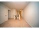 Upstairs hallway with neutral carpet, white walls, and a staircase at 107 Goose Rd, Summerville, SC 29483
