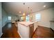 Modern open concept kitchen overlooks living area with granite counters and stainless steel appliances at 107 Goose Rd, Summerville, SC 29483