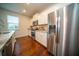 Well-equipped kitchen features stainless steel appliances, and granite countertops with a view to the outside at 107 Goose Rd, Summerville, SC 29483
