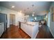 Open kitchen featuring granite counters, stainless appliances, with a seamless flow into the living area at 107 Goose Rd, Summerville, SC 29483